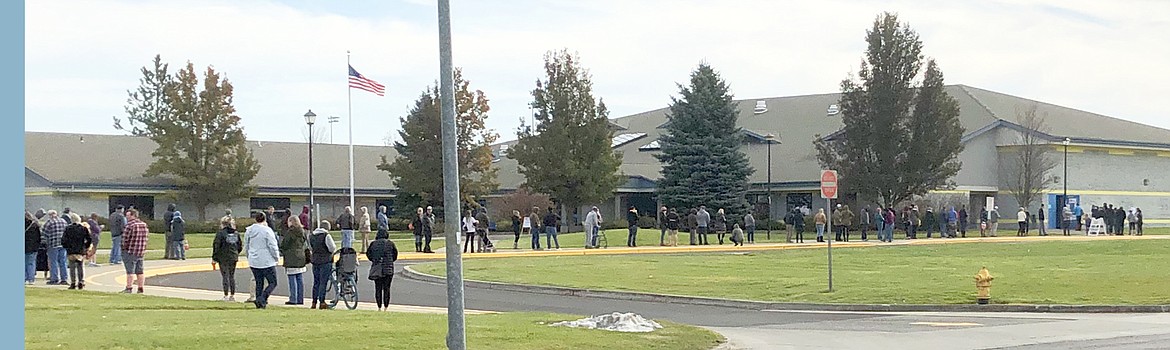 People wait in a long line to vote at Prairie View Elementary School on Tuesday morning.