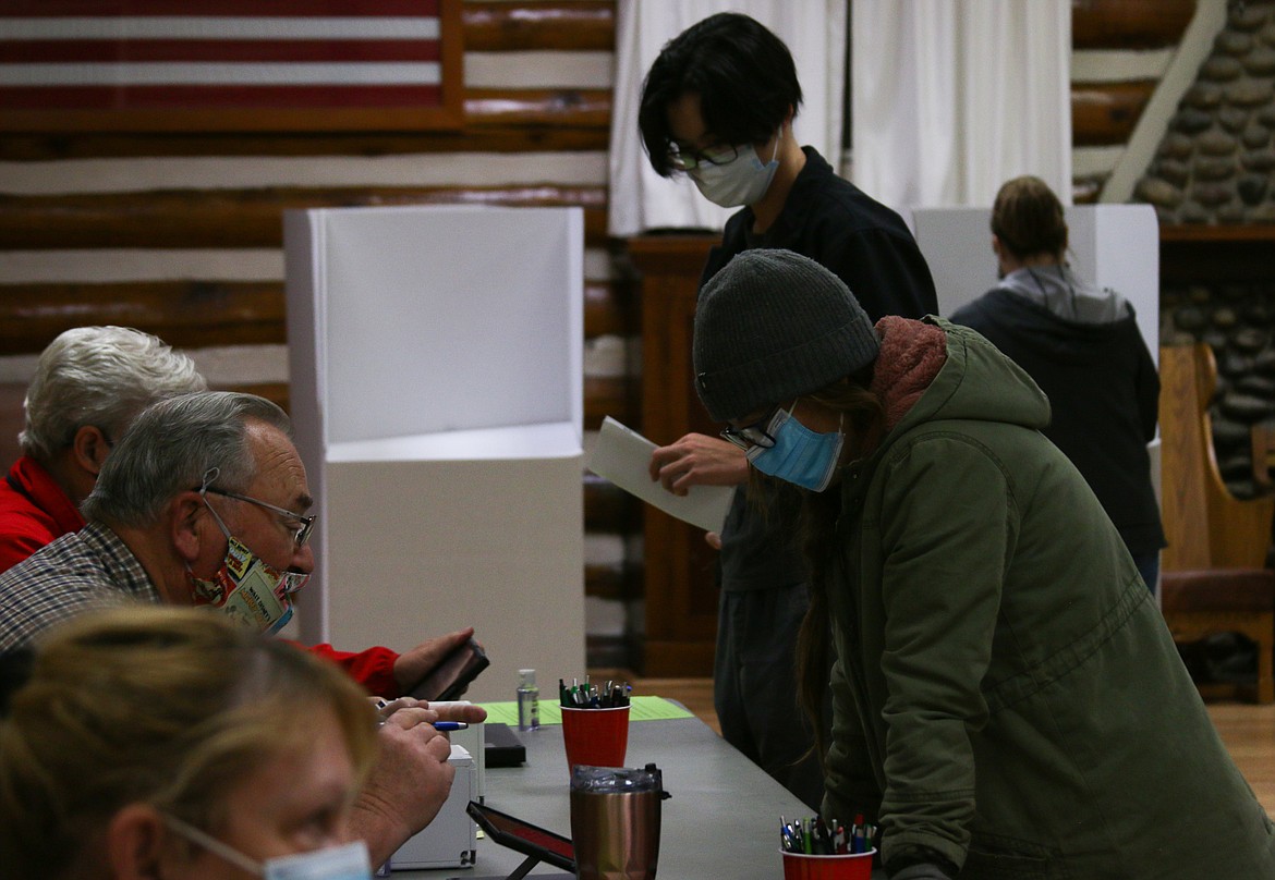 Residents register to vote Tuesday night at Sandpoint Community Hall.