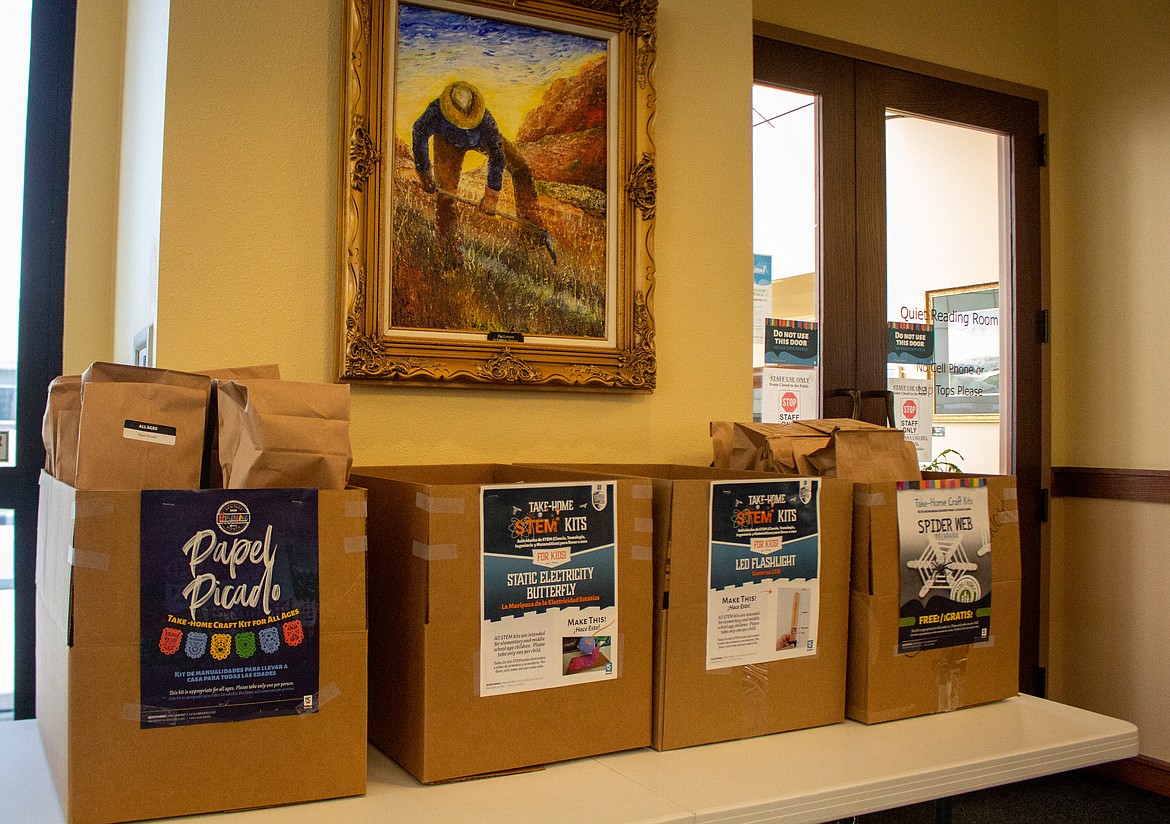 Craft kits, a popular item in the Quincy community while the Quincy Public Library's doors were closed, line the table beside the entrance.