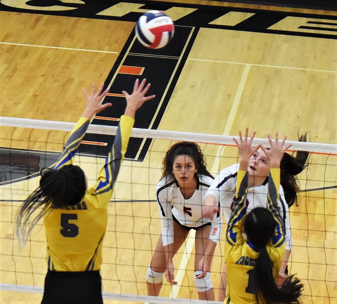 Ronan's LaReina Cordova keeps her eyes on the ball as teammate Rylie Lindquist fires a shot at Libby defenders. (Scot Heisel/Lake County Leader)