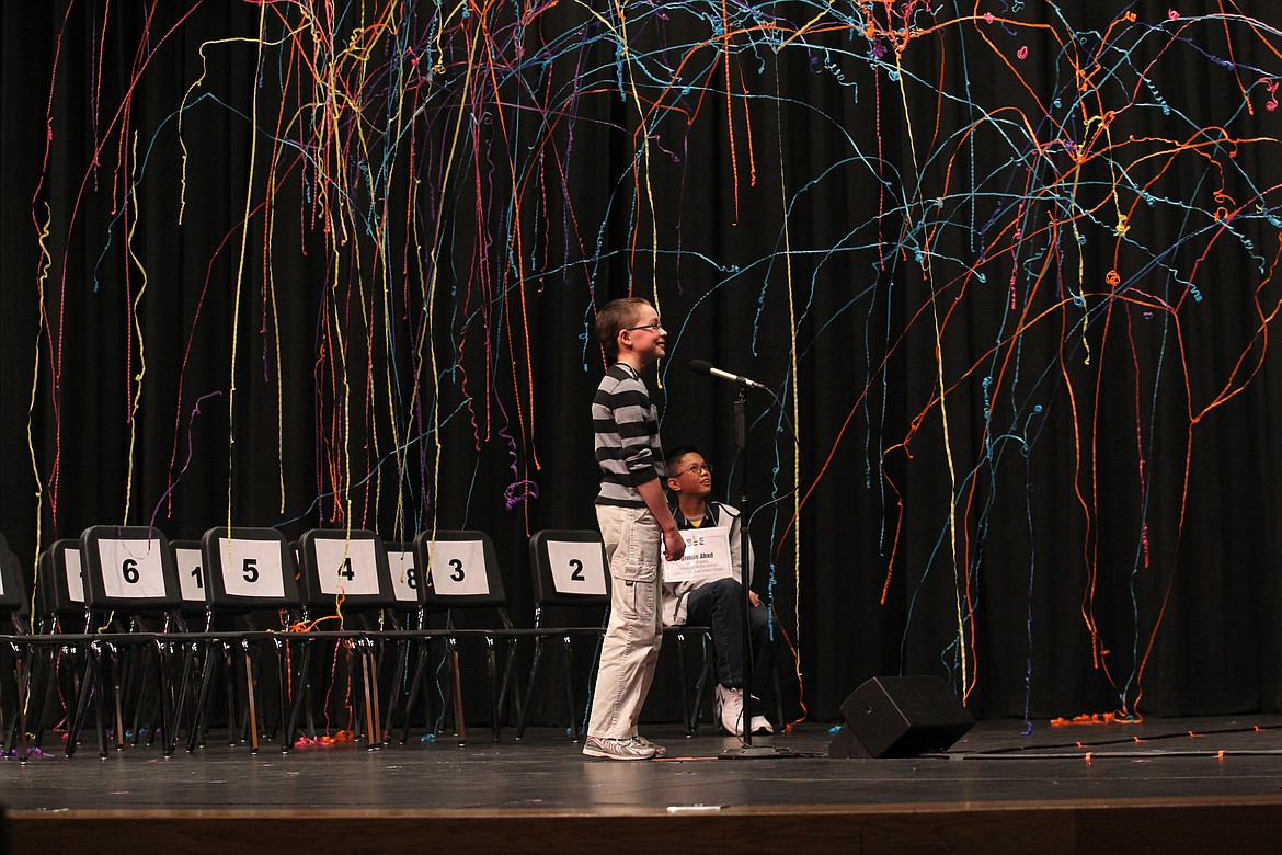 Spelling champ Joseph Moran smiles with satisfaction as confetti rains onto the stage after he correctly spelled his final word, “surveillance,” during the 15th annual North Idaho Regional Spelling Bee at North Idaho College in 2018. NIC announced Wednesday it is retiring from its involvement with the bee.