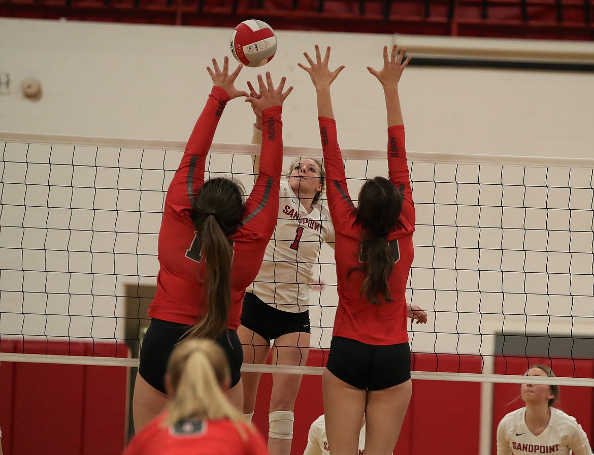 Senior outside hitter Gabby Hicks hits a kill over a pair of Moscow players during the 4A Region 1 loser-out match on Oct. 20 at Les Rogers Court. Hicks earned all-league honors for the second straight season.