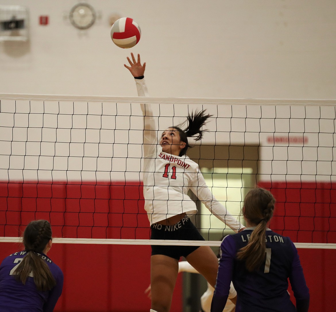 Senior middle blocker Bella Phillips goes up for a block during a match against Lewiston on Oct. 10. Phillips earned all-league honors for the first time.