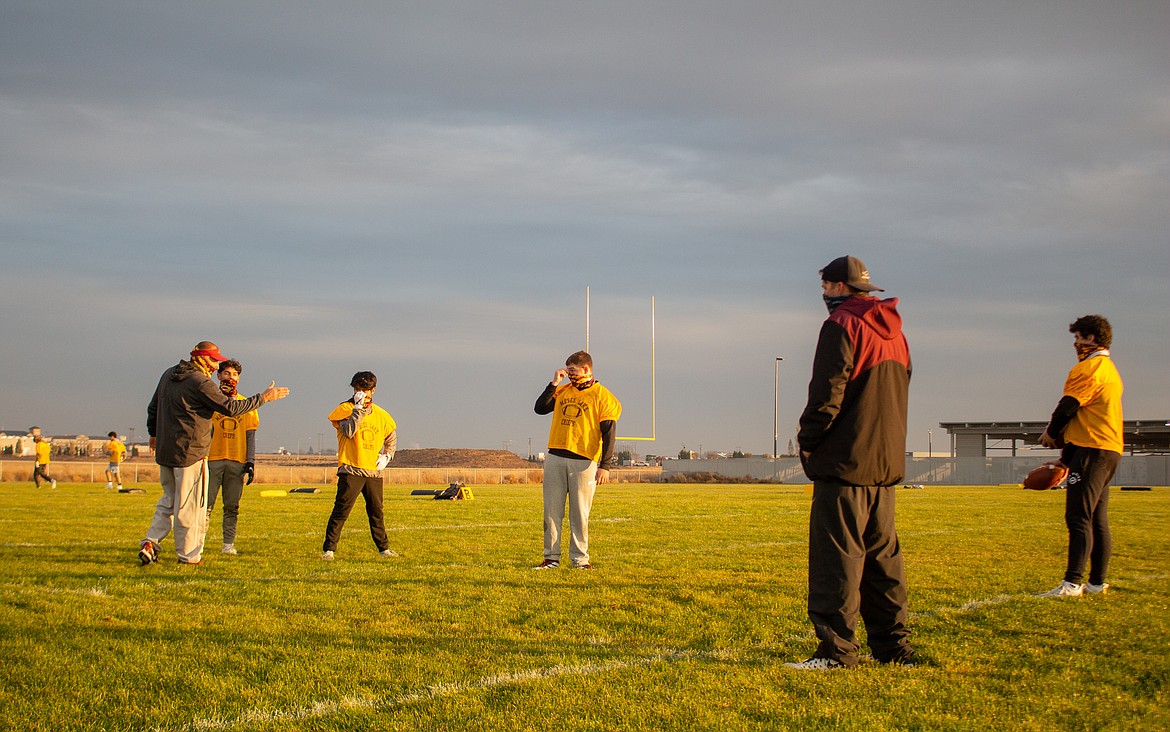 MLHS head football coach Todd Griffith gives instructions to his players during a drill on Tuesday afternoon at the high school field.