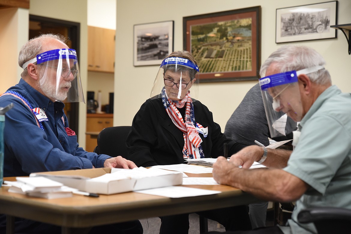 Election judges process votes at the Lincoln County Courthouse on Election Day.