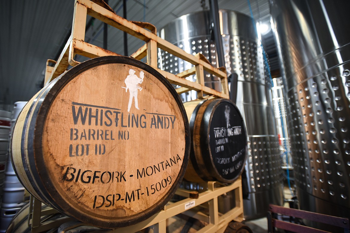 Barrels of Whistling Andy whiskey sit near the tanks for brewing cider at Big Mountain Ciderworks on Tuesday, Nov. 3. (Casey Kreider/Daily Inter Lake)