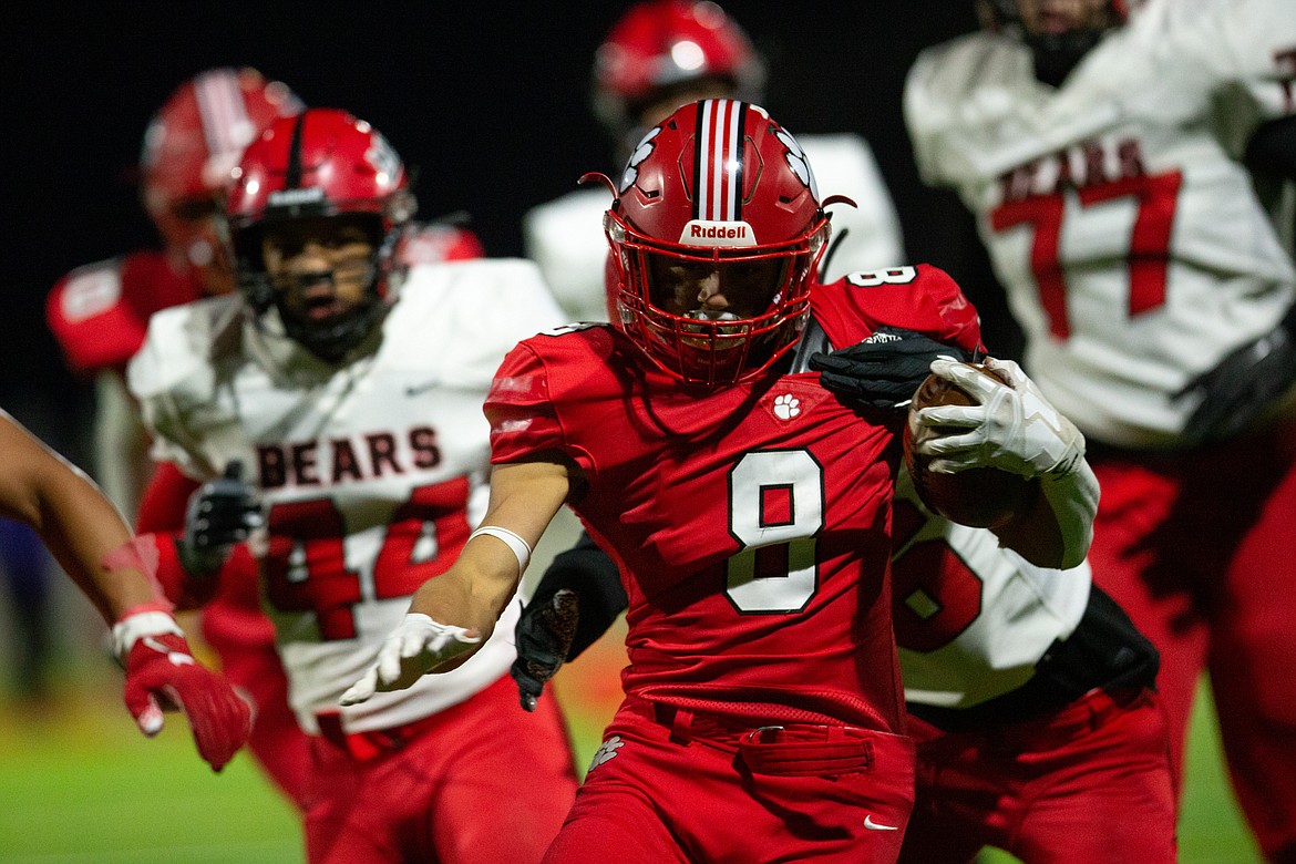 Senior Braden Kappen runs through the Moscow defense during Friday's game at War Memorial Field.