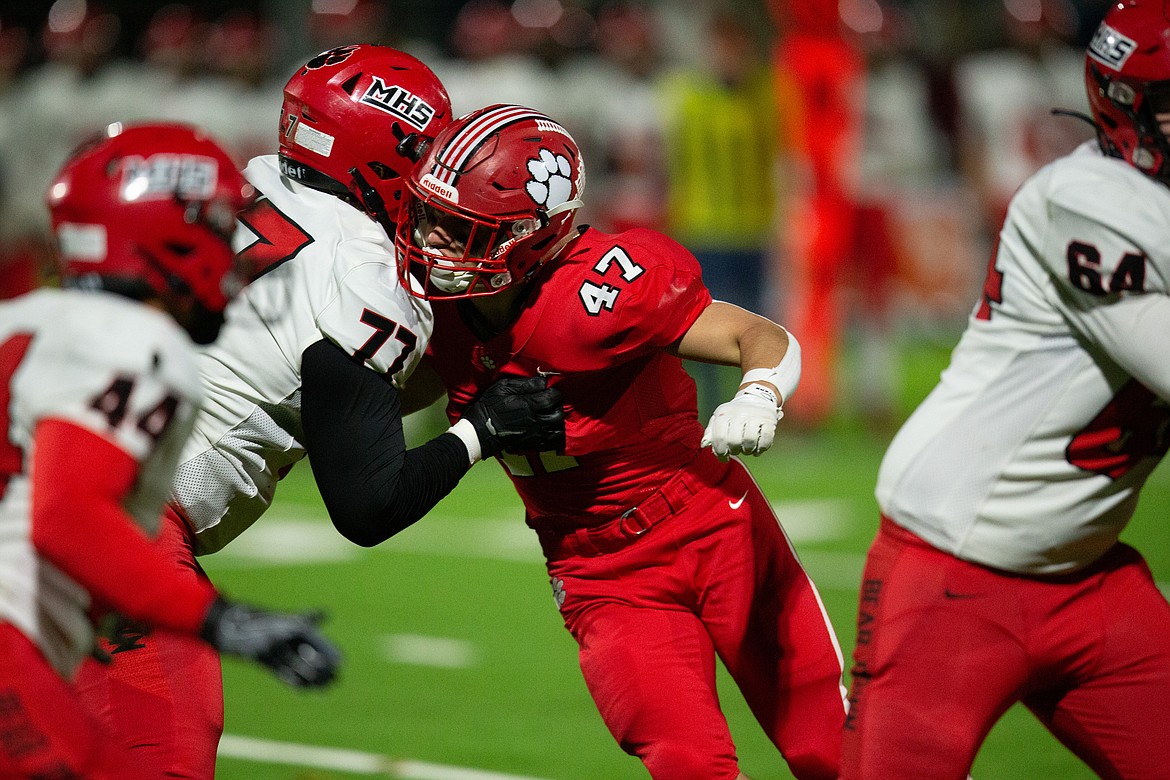 Senior Isaac Webb fights through a block during Friday's game.