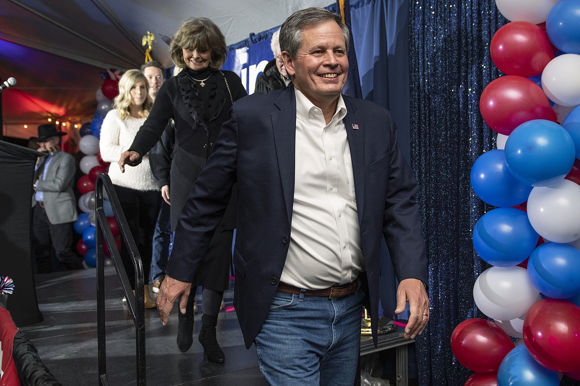 Sen. Steve Daines, R-Mont., with his wife Cindy, arrives to address his supporters after his race was called by The Associated Press, early Wednesday, Nov. 4, 2020, in Bozeman, Mont. (AP Photo/Tommy Martino)