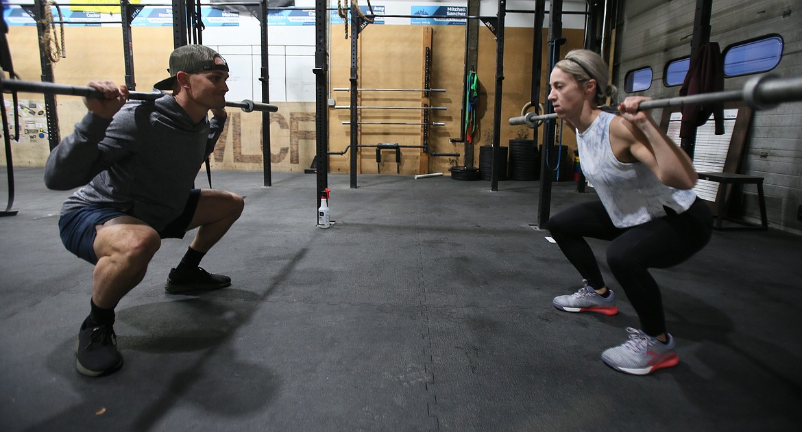 Wildland CrossFit co-owner Justin Wearne and friend Michelle Kleinberg get buffed for Borah Elementary as they compete in the 2020 Wildland Open on Friday.