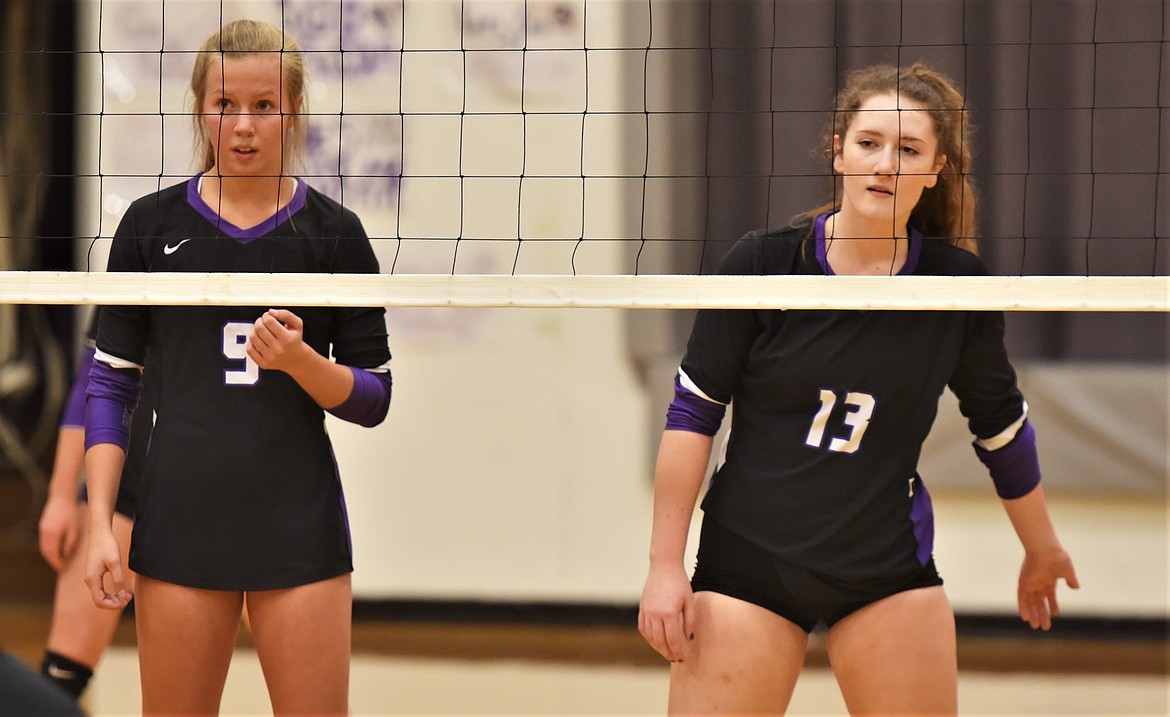 Carlee Fryberger and MollyKate Sullivan prepare for an Eagles serve on Thursday night in Charlo. (Scot Heisel/Lake County Leader)
