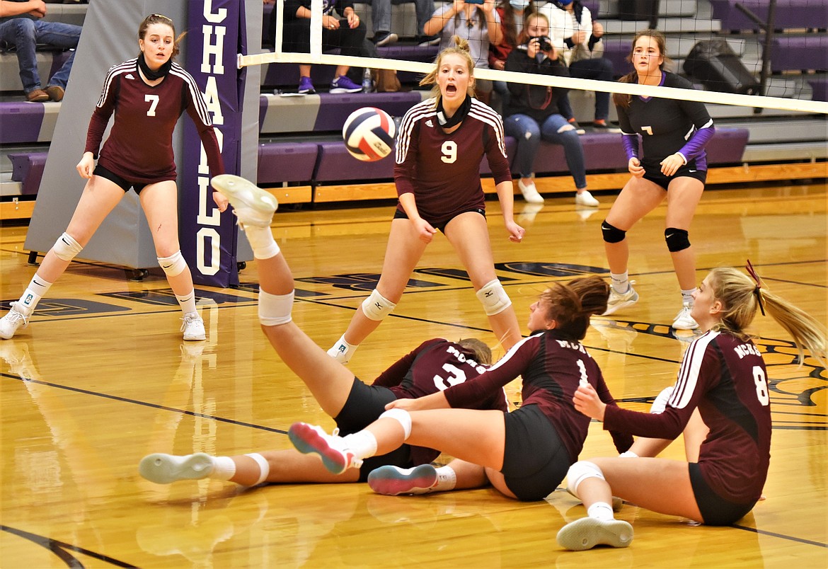 Manhattan Christian players hit the floor Thursday night in Charlo. (Scot Heisel/Lake County Leader)