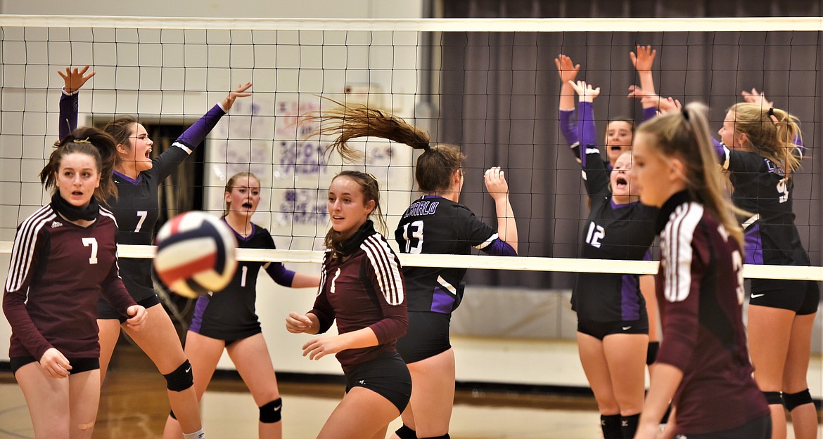 The Lady Pirates celebrate after winning a point agasinst Manhattan Christian. (Scot Heisel/Lake County Leader)