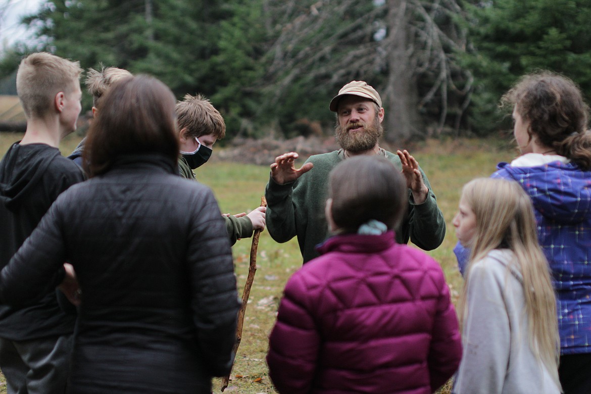 Dave Kretzschmar talks to students at Pine Street Woods Wednesday afternoon.