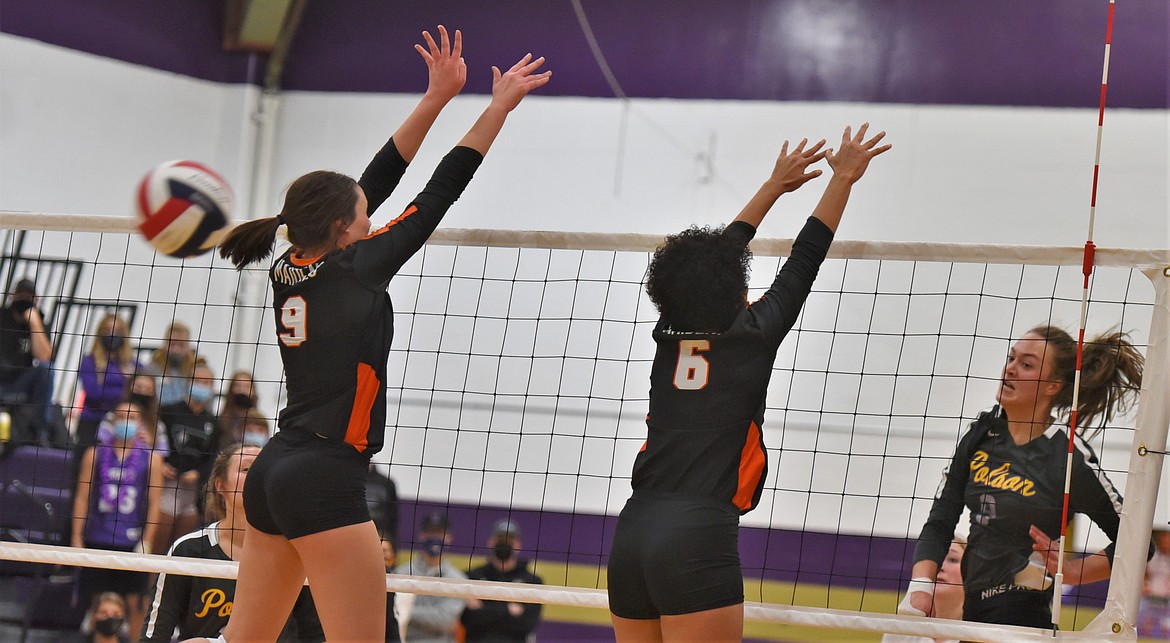 Polson's Maggie Todd blasts one by Ronan defenders Madeline McCrea (9) and Adrianna Tatukivei (6). (Scot Heisel/Lake County Leader)