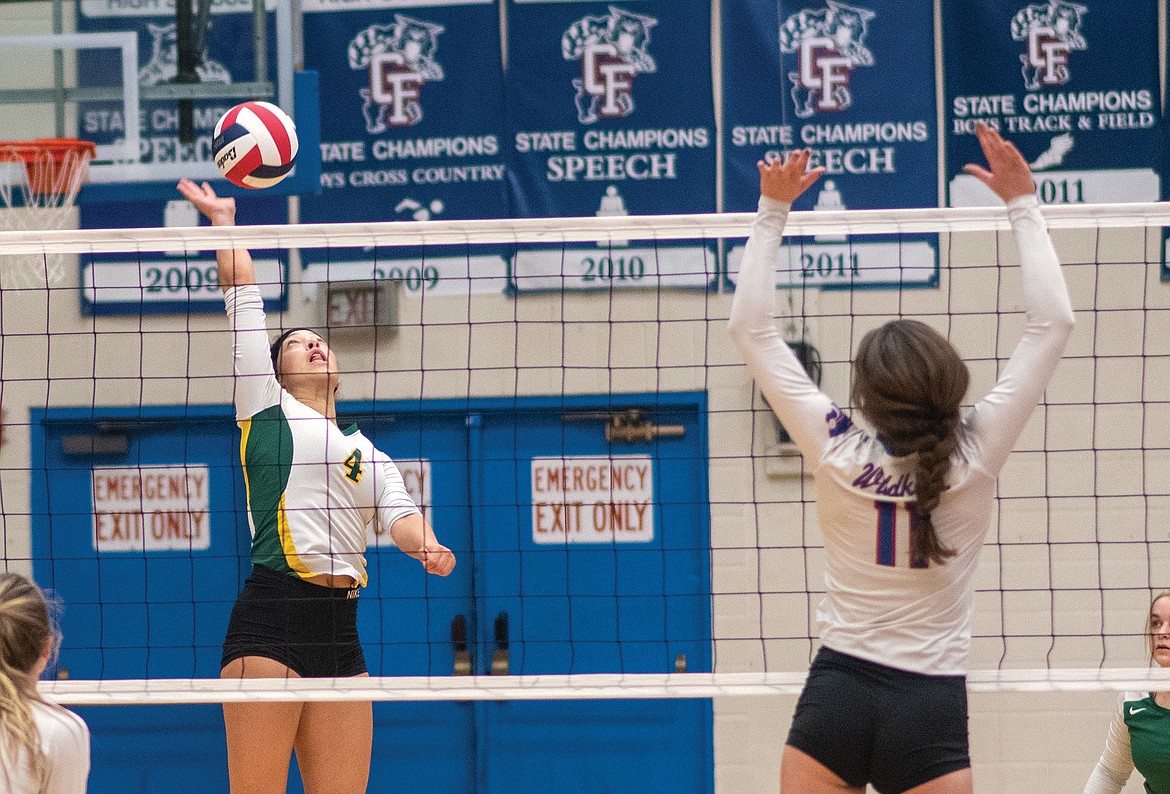 Bulldog junior Emma Trieweiler hits the ball over the net against the Wildkats last week in Columbia Falls. (Chris Peterson/Hungry Horse News)