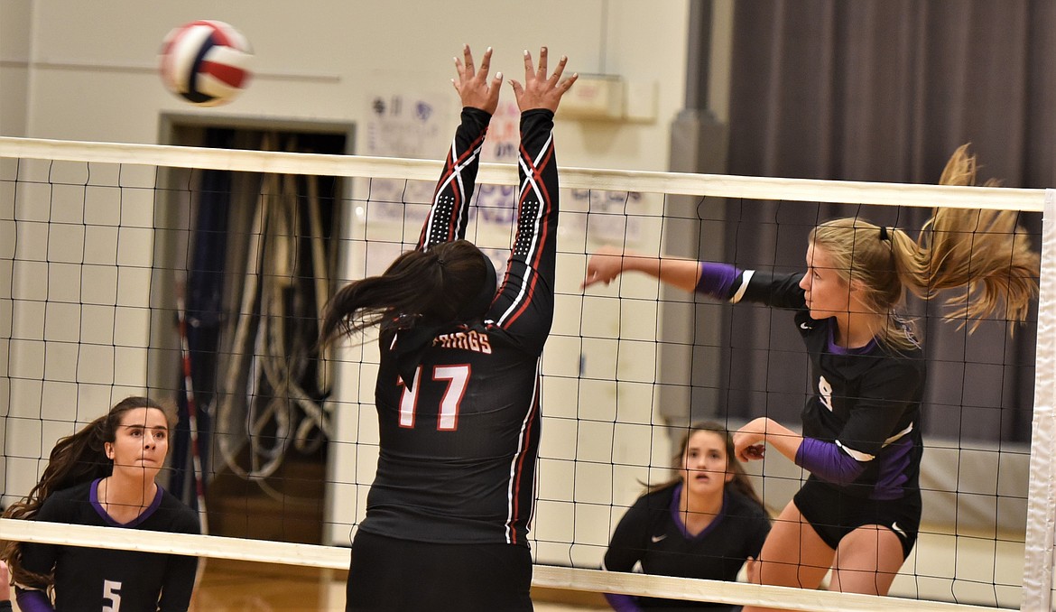 Charlo's Carlee Fryberger fires a shot past Lizzy Fisher (17) on Saturday night. In the background are Lady Vikings Hayleigh Smith (5) and Mila Hawk. )(Scot Heisel/Lake County Leader)