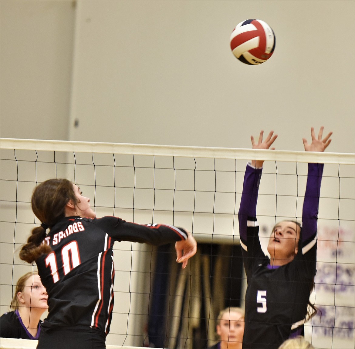 Charlo's Hayleigh Smith (5) rises to defend a shot by Hot Springs junior Lily Winn on Saturday. (Scot Heisel/Lake County Leader)