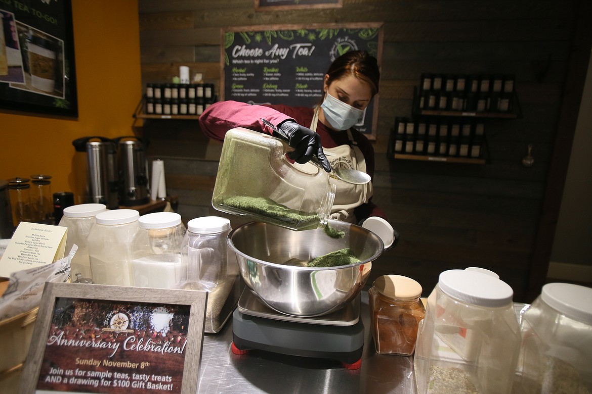 The Spice and Tea Exchange retail expert Ashlee Felkher mixes dried dill weed into a rustic ranch blend in the Riverstone store. Spice and Tea is planning a 12 Days of Christmas sale starting Dec. 1 to offer daily deals leading up to Christmas.