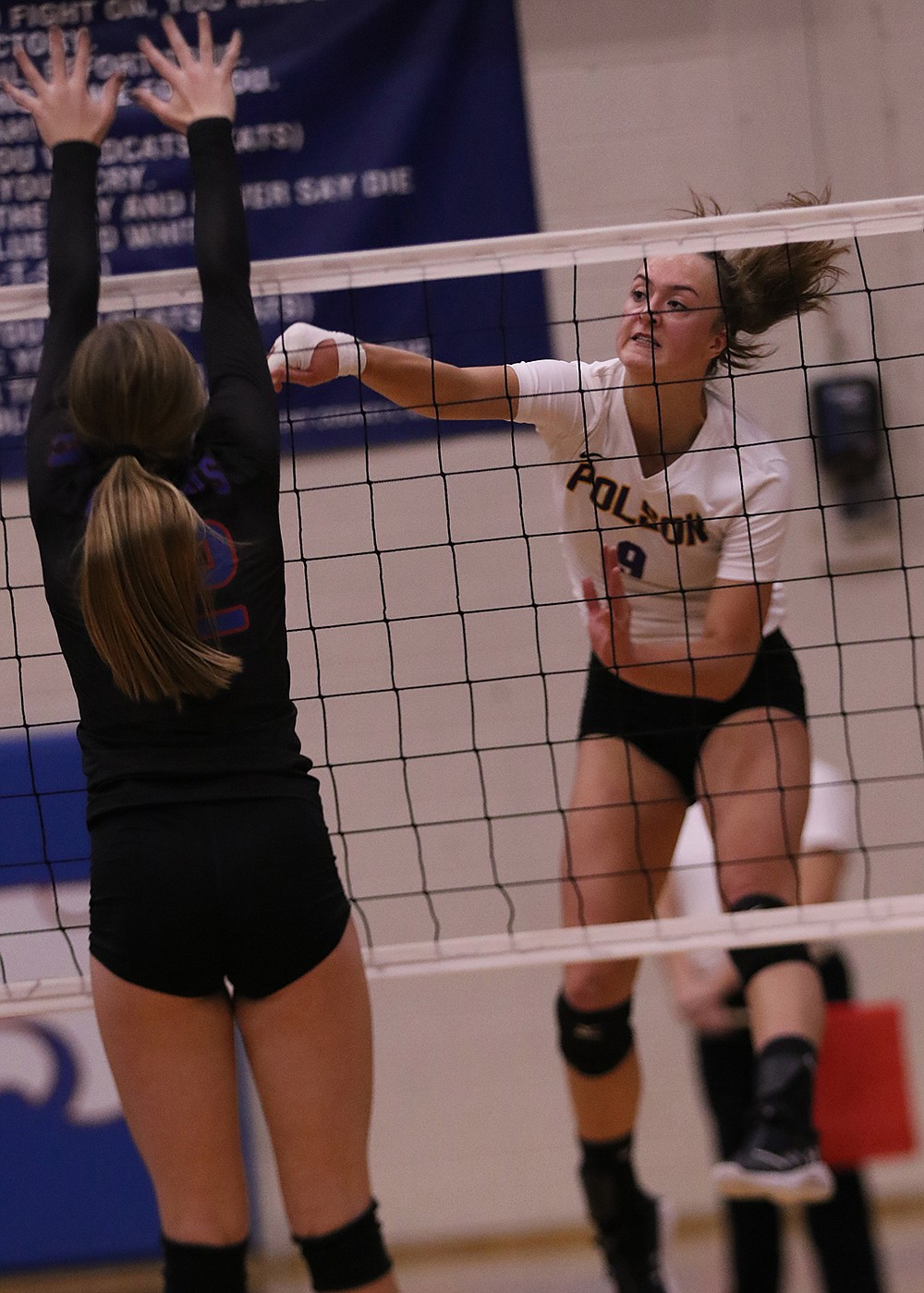 Maggie Todd gets another kill against Columbia Falls on Saturday. (Bob Gunderson)