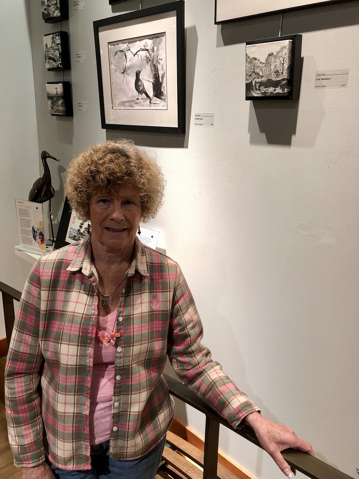 Moses Lake artist Judy Kalin with some of her work at the Moses Lake Museum and Art Center. Kalin is a member of the Desert Artists group and has contributed several miniature paintings to the art show.
