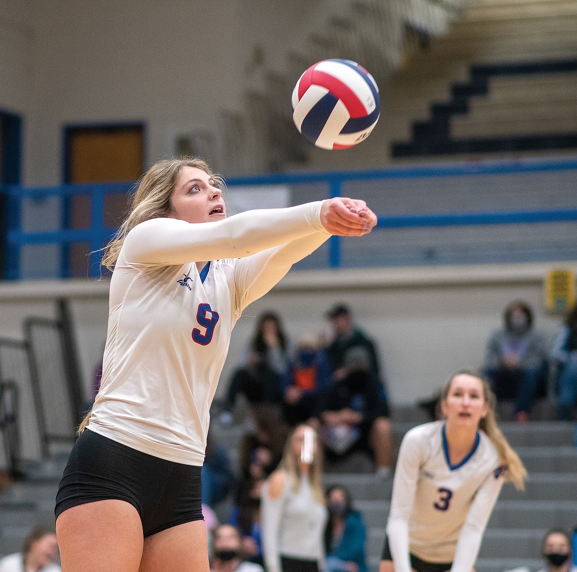 Hannah Schweikert bumps the ball in the divisionals semifinal match against Whitefish on Friday. (Chris Peterson/Hungry Horse News)