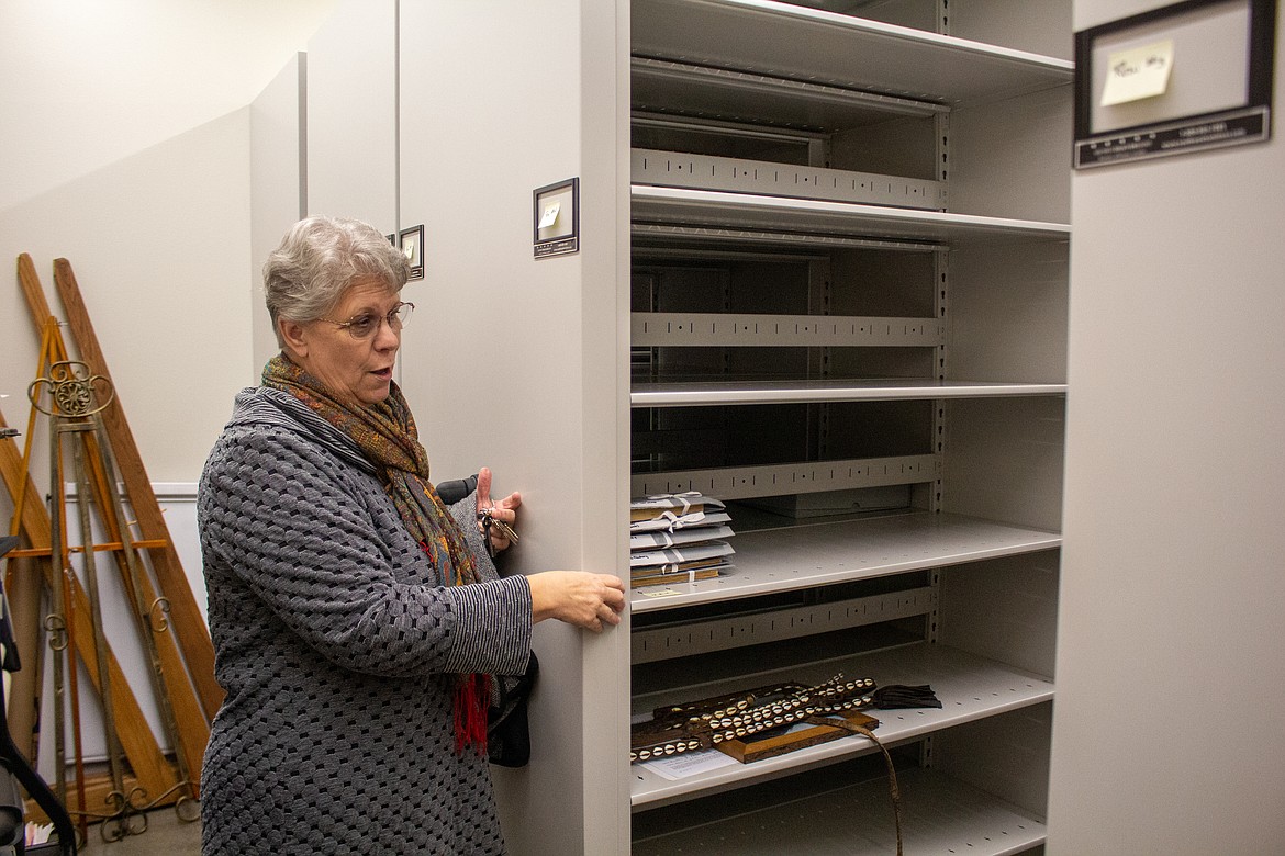 Harriet Weber and Quincy Museum staff showcases the new climate-controlled archive that historical items, documents and photographs are being moved into currently.