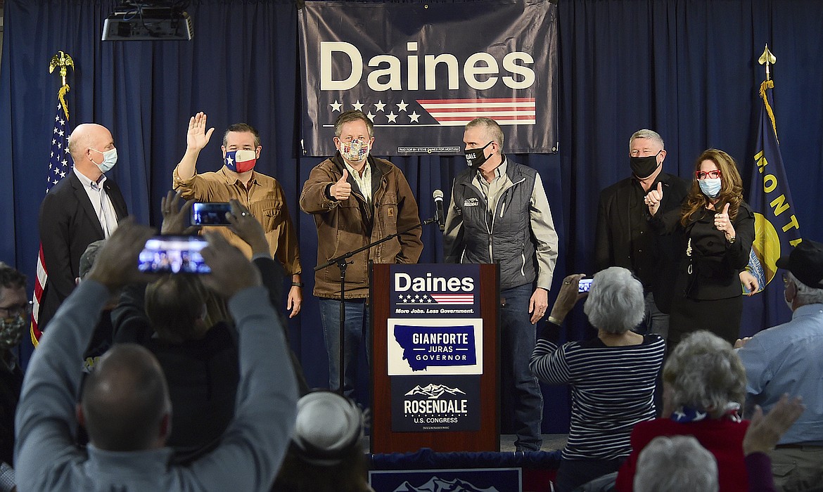 In this Thursday, Oct. 29, 2020, photo, Sen. Ted Cruz, second left, R-Texas, campaigns for Sen. Steve Daines, third left, of Montana at the Billings Hotel in Billings, Mont. Others in attendance are Matt Rosendale, third right, Greg Gianforte, left, Troy Downing, second right, and Elsie Arntzen, right. (Larry Mayer/The Billings Gazette via AP)