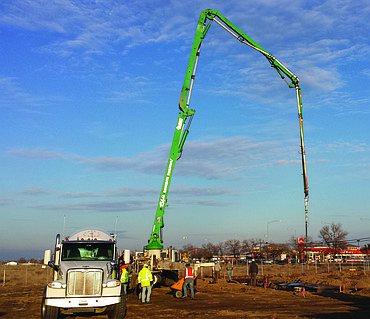 Construction workers prepare to pump concrete Thursday at the site of the new McPartland Law Offices building at the corner of West Broadway Avenue and South Interlake in Moses Lake. The site is at a corner of a long undeveloped rectangle of land and a prominent location along a main entrance from Interstate 90 to Moses Lake.