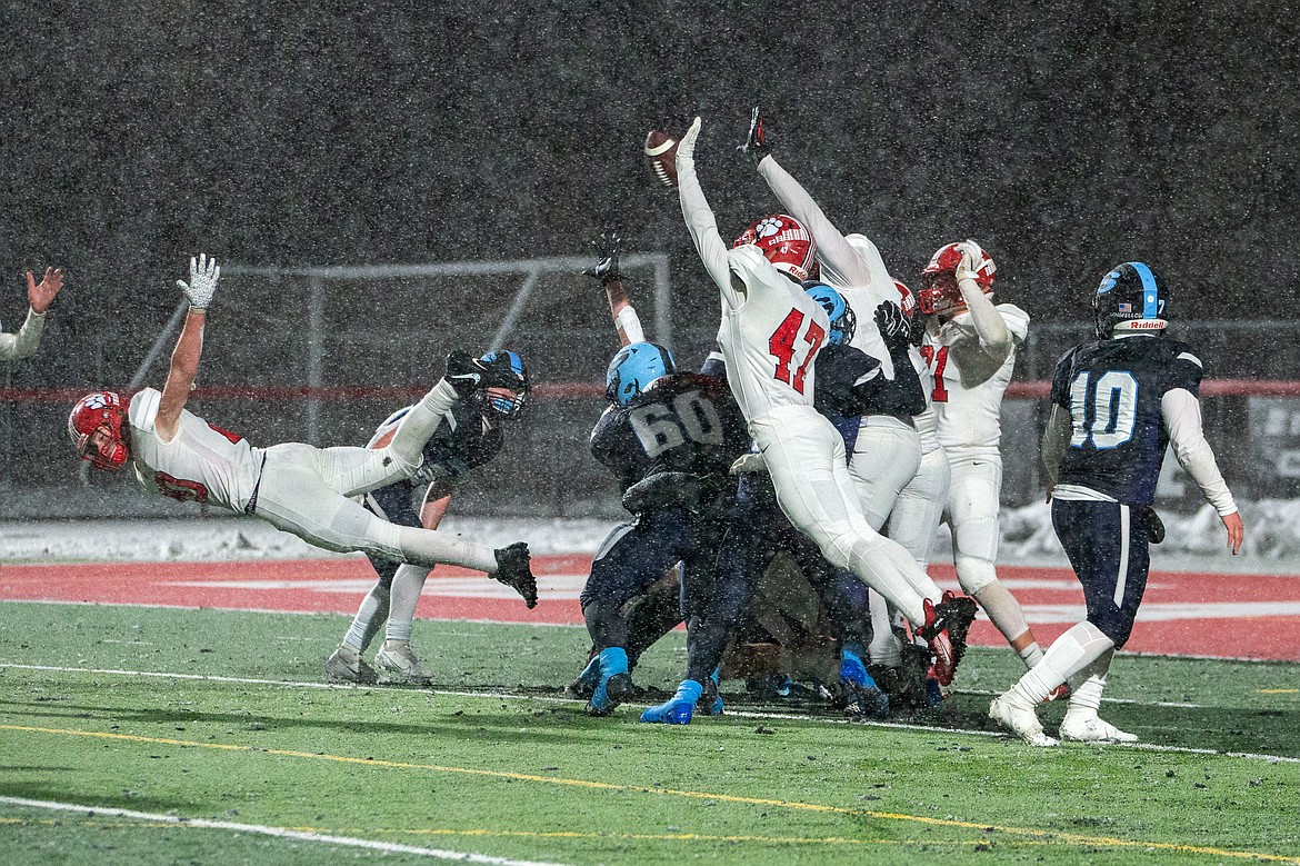 Sandpoint rises up to block a PAT during Friday's game.