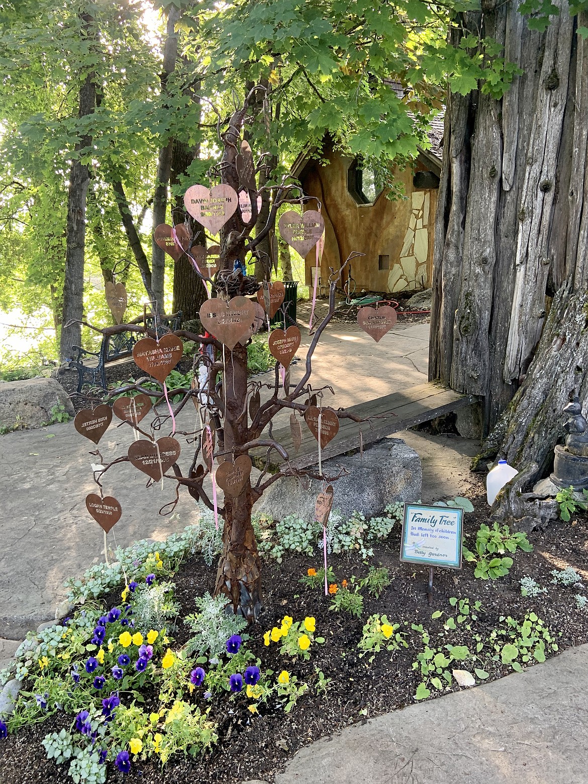 The family tree, located in the Healing Garden, commemorates children who passed. It is the collaborative work of community members, artist and Hospice volunteer Betty Gardener and Bonner General Health Community Hospice. The leaves display the child's name and their date of birth. Anyone wishing to add a leaf in memory of a child  or a name on the Memorial Wall is invited to do so. There is a $50.00 donation is suggested to add a leaf to the family tree, and a $100 donation suggested for the Memorial Wall. Funds go toward Bonner Community Hospice. Bonner Community Hospice can be reached at 208-265-1179.