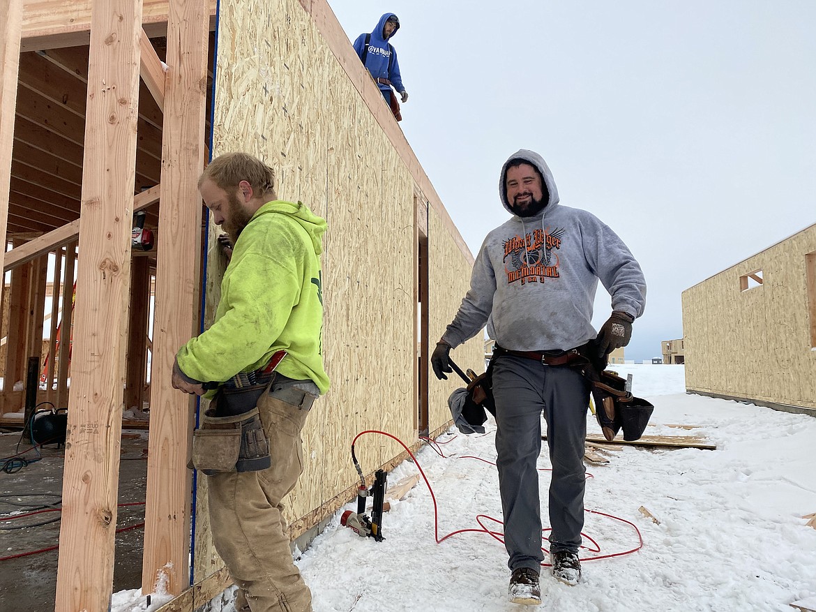 The city of Rathdrum can almost not build houses fast-enough for its growing population as people migrate to North Idaho from urban areas. Despite the cold and snow, employees of LP Construction Services are working tirelessly on the Brookshire development to keep up with demand. (MADISON HARDY/Press)