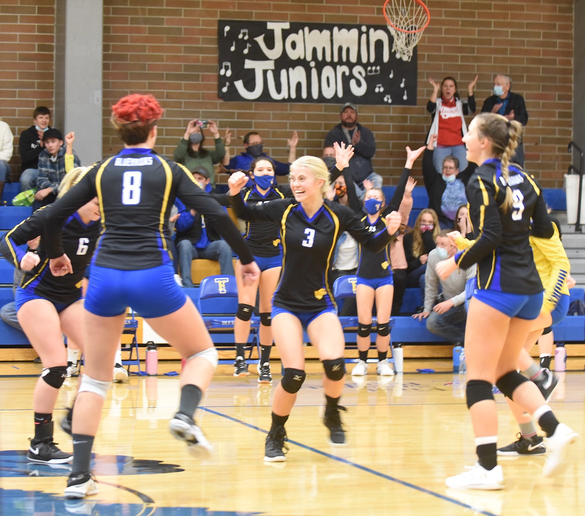 The Thompson Falls volleyball team celebrates its 7B title Oct. 30. The Lady Hawks made the state tournament last weekend. (Scott Shindledecker/Valley Press)