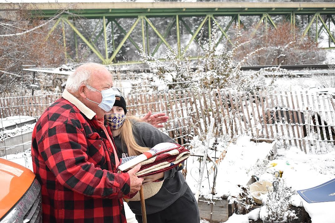 St. Regis High School student Baylee Pruitt shares a warm moment with U.S. veteran John Cheesman after presenting him with a Quilt of Valor on Veterans Day. (Andrew Sanford/Mineral Independent)