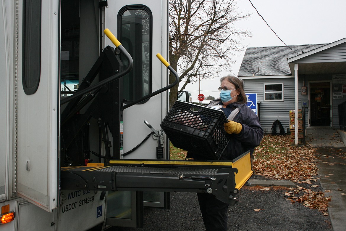 Karin Smith, driver for People for People, loads food from the Othello Food Bank for delivery to Hatton. The delivery is the result of a new partnership between the two organizations.