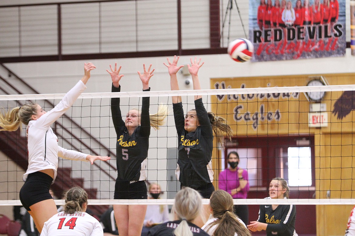 Polson's Hallie Moss (5) and Liz Tolley (7) defend a shot from a Glendive player at the class A state tournament in Sidney. (Dillan Schorfheide/Sidney Herald)