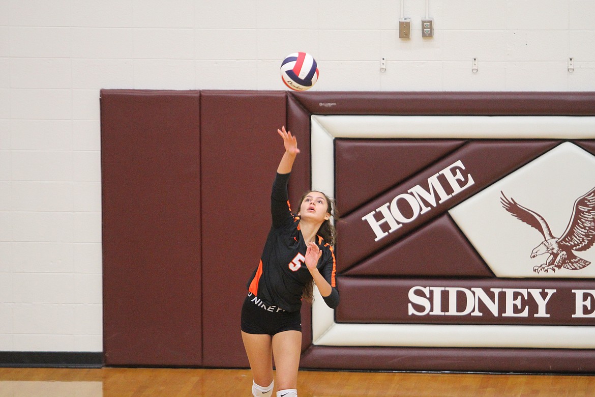 Ronan's LaReina Cordova hits a serve against Billings Central on Friday. (Dillan Schorfheide/Sidney Herald)