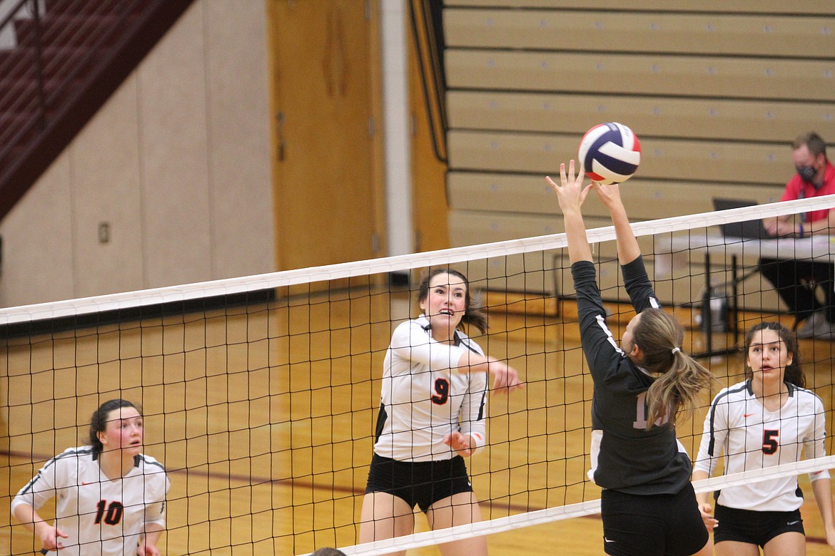 The Maidens' Madeline McCrea hits a shot past Polson's McKenna Hanson at the class A state tournament in Sidney. At left is Rylie Lindquist, and at right is LaReina Cordova. (Dillan Schorfheide/Sidney Herald)