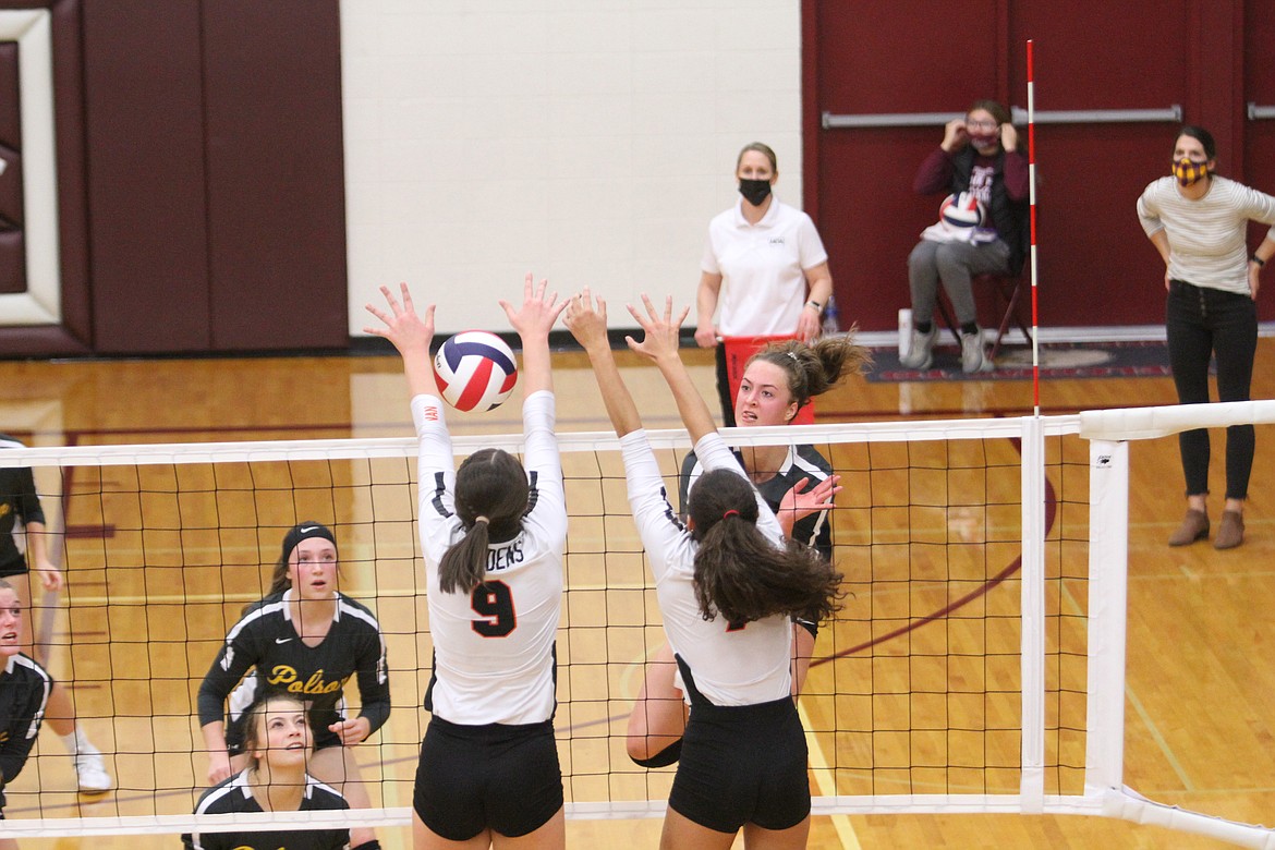 Polson's Maggie Todd (9) fires a shot past Ronan's Madeline McCrea (9) and Leina Ulutoa during their state tournament match Saturday in Sidney. (Dillan Schorfheide/Sidney Herald)