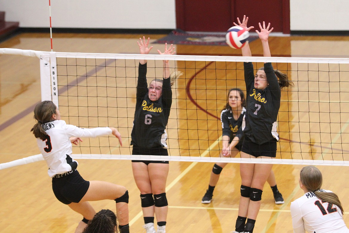 Polson's Berkley Ellis (6) and Liz Tolley (7) defend against a shot by Ronan's Olivia Clairmont during their state tournament match in Sidney. (Dillan Schorfheide/Sidney Herald)