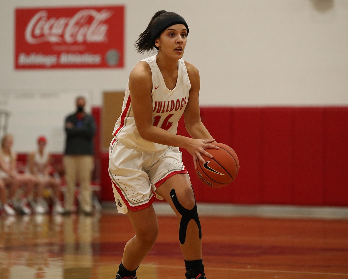 Senior Bella Phillips looks to pass the ball to an open teammate during the first half of Tuesday's game.