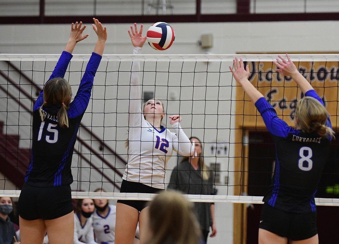 Lauren Falkner spikes the ball past the Blue Devils in a match against Corvallis last Friday. (Teresa Byrd/Hungry Horse News)