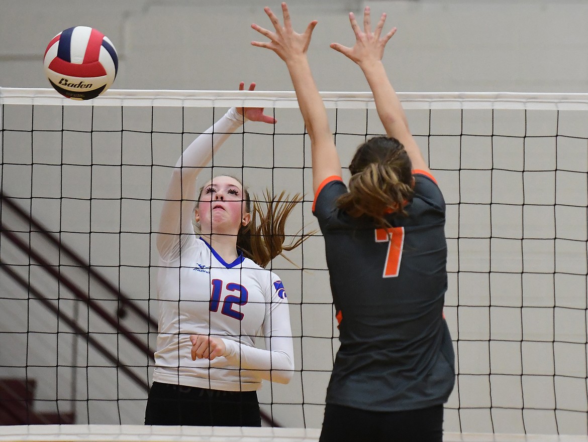 Lauren Falkner spikes the ball past Hardin in their second match of the state tournament last Thursday. (Teresa Byrd/Hungry Horse News)