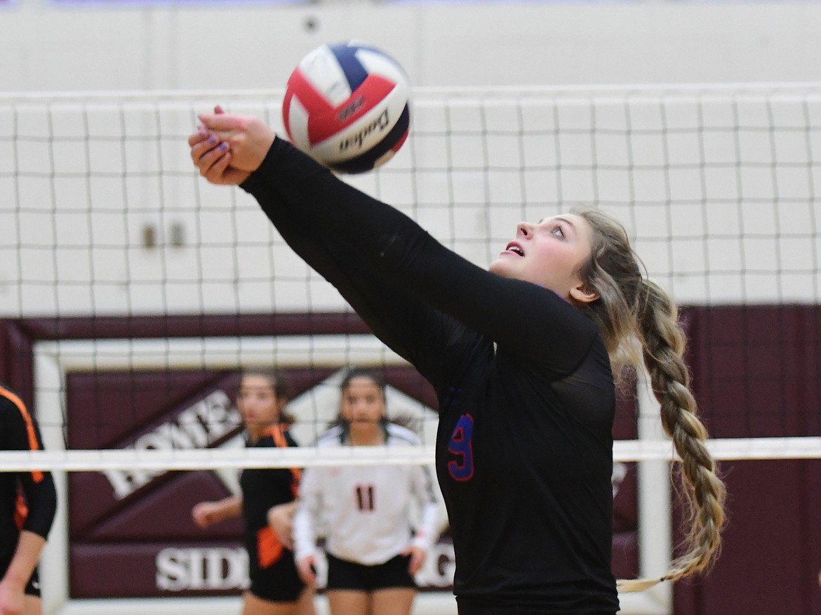 Hannah Schweikert continues the rally in a match against Ronan at the state tournament last week. (Teresa Byrd/Hungry Horse News)