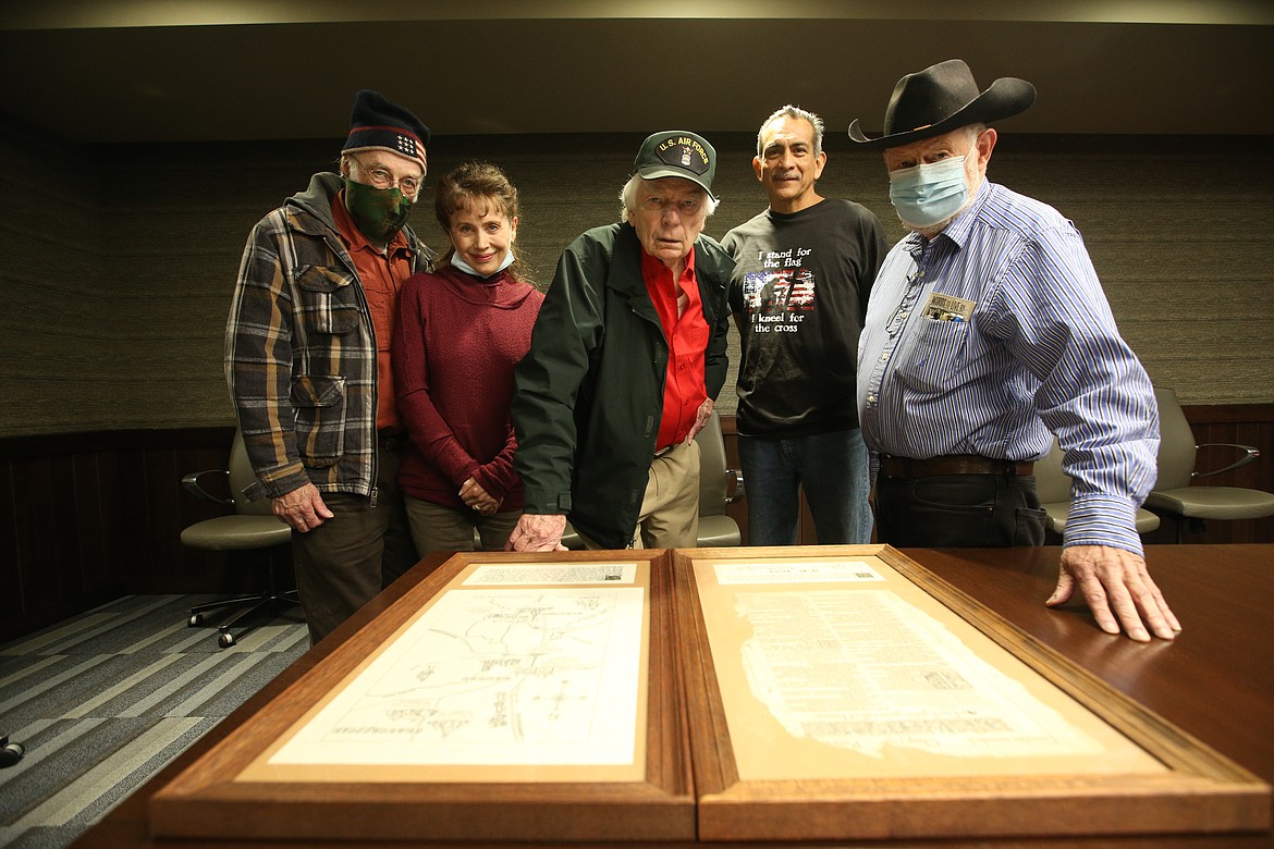 History Club members examine two pages of a 1603 Geneva Bible found hidden for 400 years in the cellar of an English manor house in Bawtry, England, where many of the Pilgrims lived, that very likely were read or belonged to a Pilgrim that came to America on the Mayflower. From left: Dr. Chuck Carter, Sandy Carter, Syd Albright, Jim Ramirez and Larry Telles.