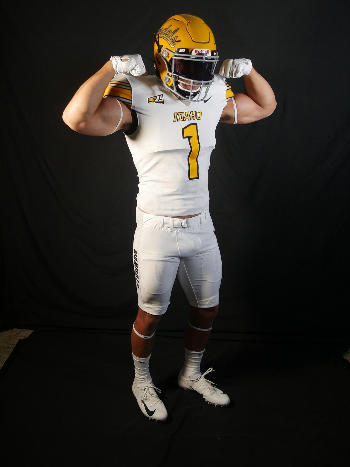 Idaho linebacker Christian Elliss shows off the new road uniform for the Vandal football team.