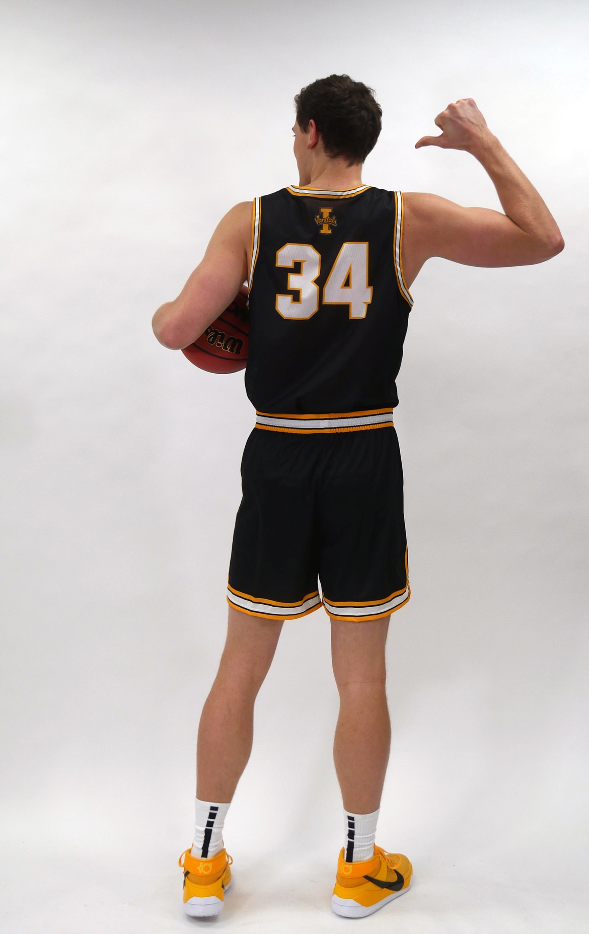 Idaho forward Scott Blakney shows off the back of the Vandal men's basketball all-black uniform.