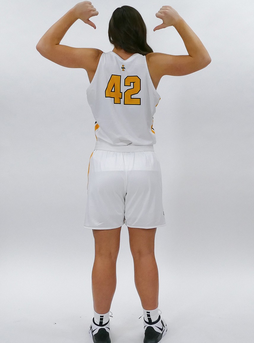 Idaho forward Natalie Klinker displays the back of the Vandal women's home jersey.