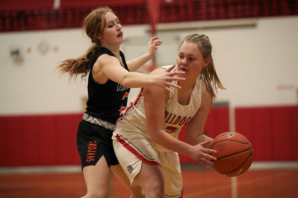 Senior Riley Cessna looks to pass to a teammate during the first half of Tuesday's game.