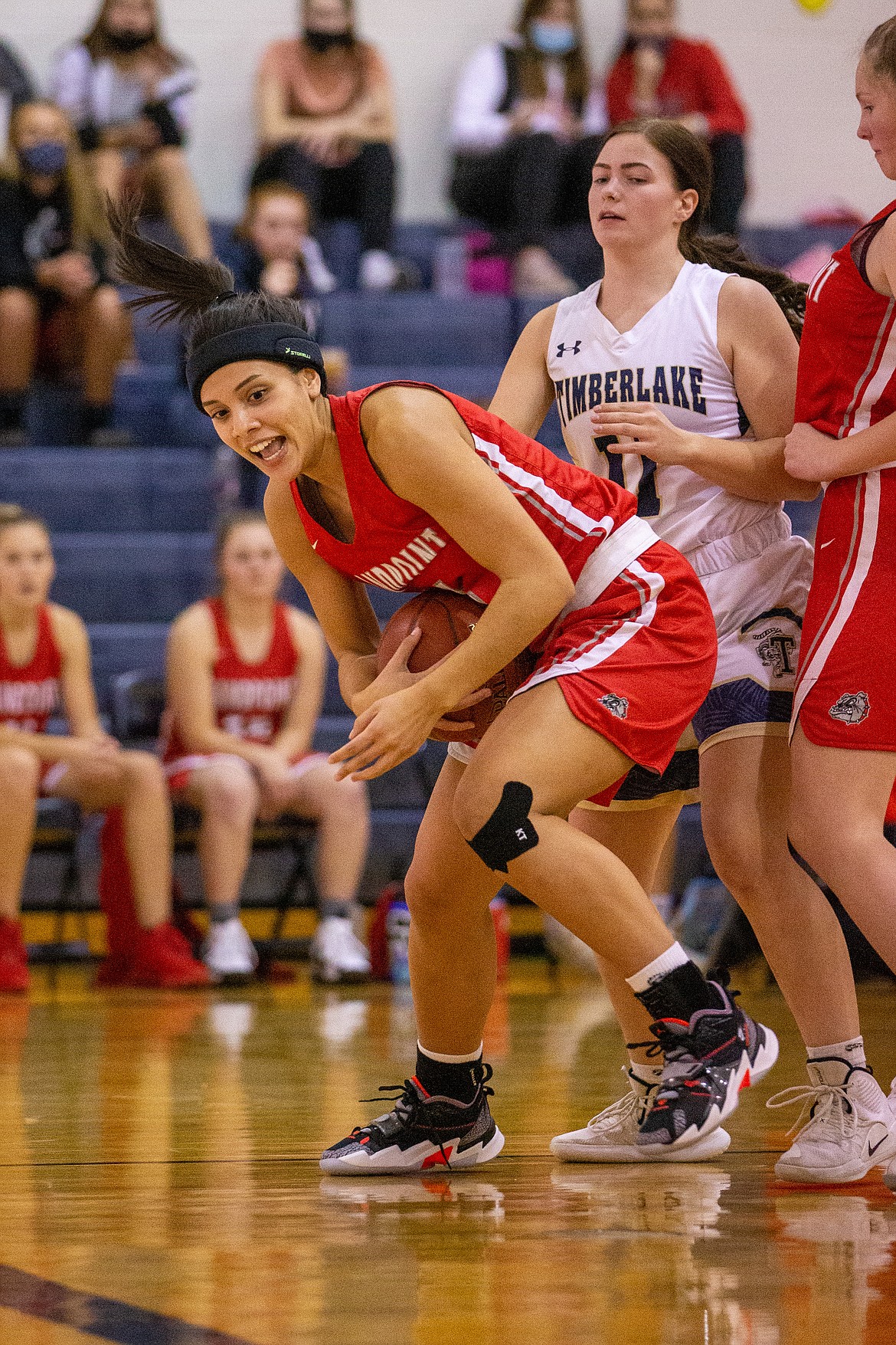 Senior Bella Phillips fights for a rebound in the paint on Thursday night.